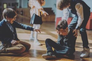 Child being bullied and laughed at by other children